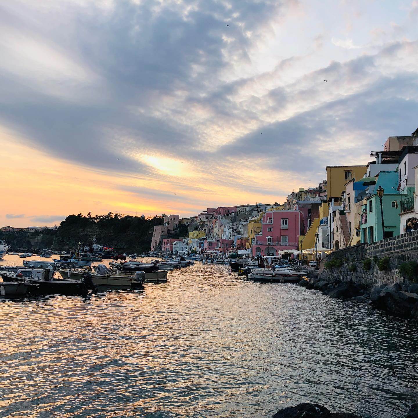 Procida - European Capital of Culture 2022. Beautiful colourful houses, the view of Marina Corricella is almost surreal. However, when you spend a few days on the island, you realise with disillusionment that things look different behind the scenes. The island is almost choked with traffic even in the low season ... Appearances are deceptive - let's hope that there is a plan for 2022 on how to deal with the new situation and balance tourism with tradition. #procida #italy #travel #culture #europeancapitalofculture