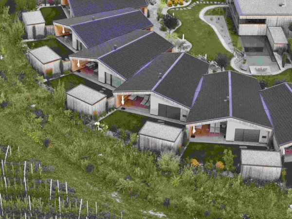Luftaufnahme des Amolaris Garden Chalets & Residence mit den Chalets, den Obstgärten und dem Schwimmteich.